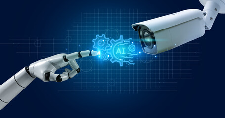 Integration of artificial intelligence (AI) with CCTV surveillance robotic hand symbolizing AI...