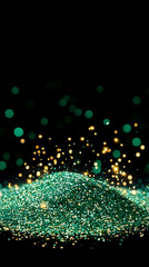 Emerald green glitter pile with gold sparkle bokeh on black background