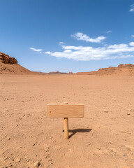 Empty desert landscape with wooden sign
