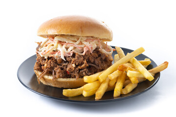 Pulled pork sandwich with coleslaw salad and french fries isolated on white background
