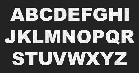 White letters of the alphabet with a mosaic texture on a dark background. Minimalistic style with a geometric pattern creates the effect of stonework or cracks on the surface. Strict, contrasting desi