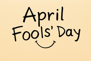 A handwritten style message for April Fools' Day is displayed with a simple smile underneath, set against a light beige backdrop.