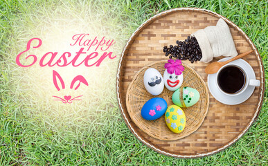 Happy Easter greeting card background idea, hot coffee with roasted coffee bean and Easter egg in wooden basket on green grass background