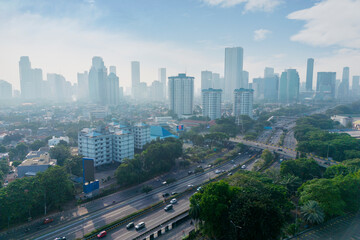 Aerial View of Modern Urban Cityscape with High-Rise Buildings and Highway in Jakarta, Indonesia