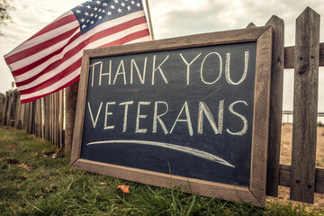 "Outdoor Chalkboard Sign Honoring Veterans with an American Flag