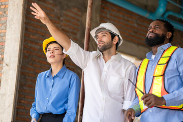 Construction engineers supervising progress of construction project. engineering or worker in...