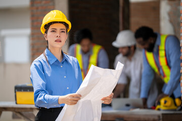 Construction engineers supervising progress of construction project. engineering or worker in...