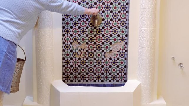 Ancient craftsmanship meets daily utility in traditional Moroccan water feature, Ritual purification spaces in Moroccan architecture, Vintage traditional bathroom in Morocco