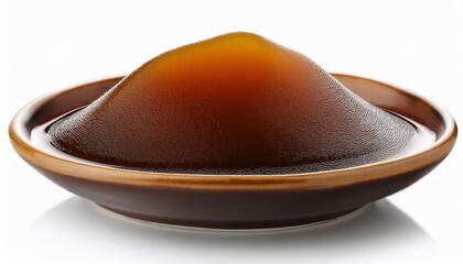 molasses in a bowl on a white background