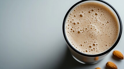 Creamy Almond Milk Beverage in Glass with Natural Almonds, Minimalist Style