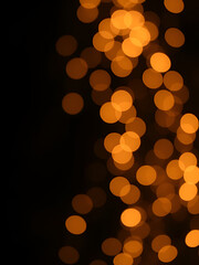 Abstract golden bokeh on black background Christmas party day