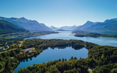 Naklejka premium Aerial photograph of mountains and a lake surrounded by nature