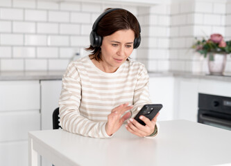 Young Woman At Home Talks On Phone Via Video Call