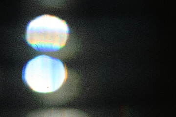 Soft colorful bokeh background. Luminous garlands of electric lights. Copy space to add text. Saturated colors. Blurry abstraction. Gentle tone. Dark night. Festive party in city. Defocus effect.