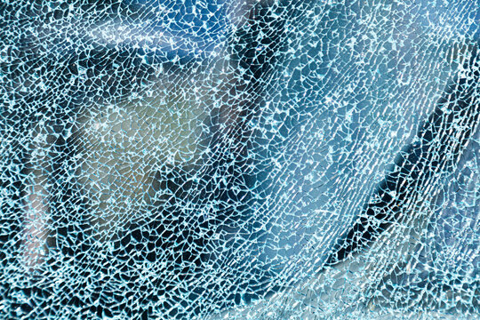 Cracks in glass of shattered car window