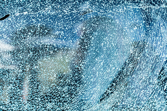 Cracks in glass of shattered car window