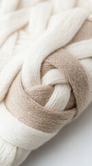 Close-up of intricately woven, creamy-beige threads.  Textured yarn detail