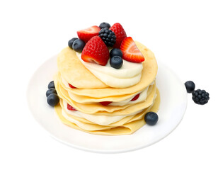 Delicious pancakes with berries and cream