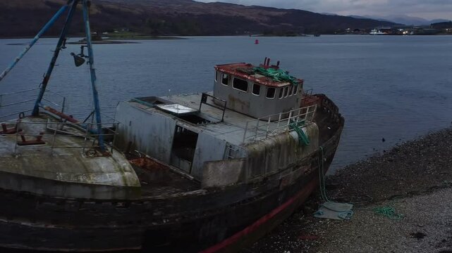 Cinematic circling of The Corpach Shipwreck on shores of Loch Linnhe near Fort William - Scotland