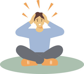 A man is sitting on the floor with his head down