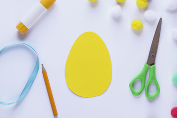 Step by step instruction. Making of handmade Easter egg from pompons. DIY Kids Craft concept. Step by step 1