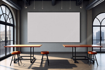 A bright studio space features a blank canvas on a gray wall, flanked by arched windows showcasing a cityscape. Two wooden tables with stools complete the minimalist interior.