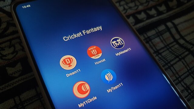 New Delhi, India - March 27 2025: Cricket fantasy apps use to bet on cricket match online, Ipl, cricket World cup, dream 11, my 11 circle, howzat and other apps on smartphone screen.