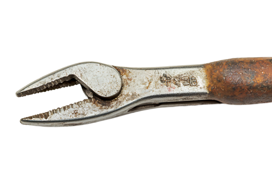 Close up of a rusty pair of pliers with a black background showing the tool in detail view tool