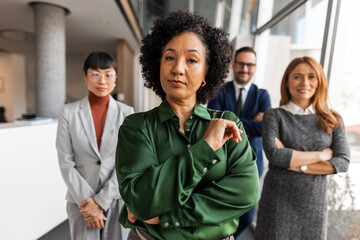 Confident Business Team Posing Together in Modern Office Setting