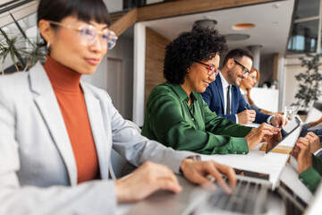 Diverse Professionals Collaborating in a Modern Office Environment
