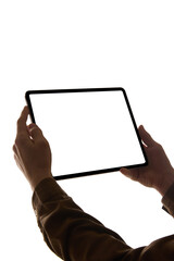Person holding tablet with blank white screen against white background, viewed from low angle....