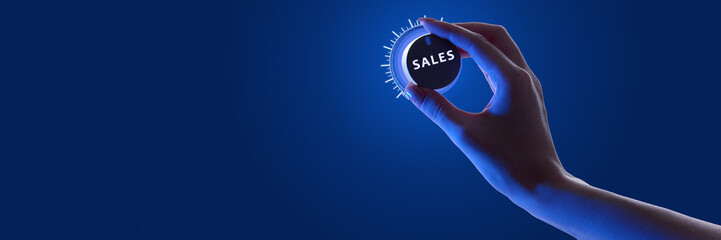 Person adjusting glowing dial labeled SALES against dark background in neon, optimization of sales...