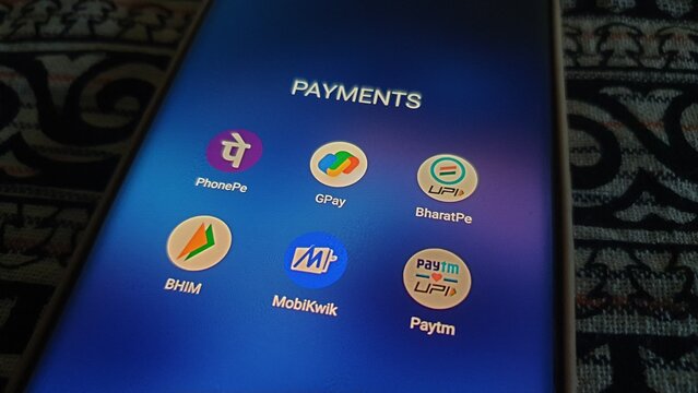 New Delhi, India - March 27 2025: Popular digital payment apps in India - Paytm, PhonePe, and Google Pay, Paytm, Bharatpe, Bhim UPI and MobiKwik - are seen on smartphone screen.