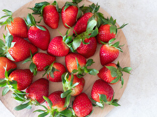 Vibrant image of ripe, juicy strawberries with rich red tones and natural texture. Summer berry, healthy lifestyle theme