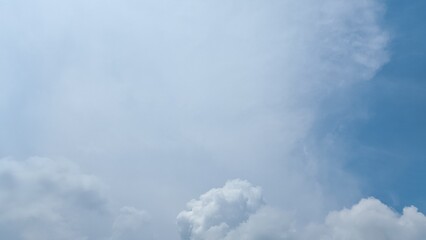Stratus clouds dance across the sky in the afternoon, their shapes intricate and distinct. Cotton tufts of cumulus clouds intertwine with stratus, smooth expanses of stratus clouds