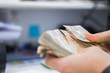 Businessman counting and exchanging money - Brazilian Real - Reais.