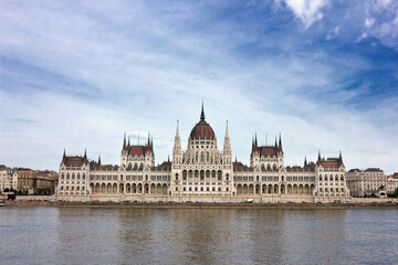 Fototapeta premium Hungarian Parliament building on the banks of the Danube. The facade of Parliament under a blue sky.