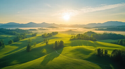 Obraz premium Breathtaking sunrise over rolling green hills, showcasing nature beauty and tranquility