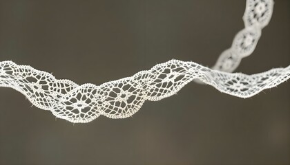 a close up of a string of white lace
