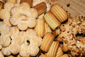 Sweet variety of homemade cookies displayed on a wooden platter for joyful gatherings