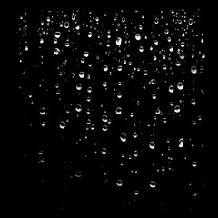 Obraz premium Raindrops on a dark windowpane close-up