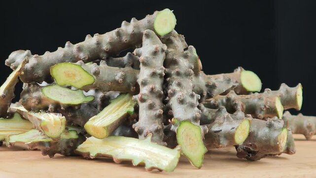 Tinospora cordifolia herb on wooden