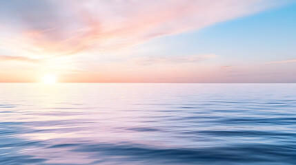 Obraz premium A peaceful seascape at sunrise, where the sky meets the calm ocean in soft pastel hues. Great for wellness branding, spa advertisements, and scenic wallpapers. Selective focus
