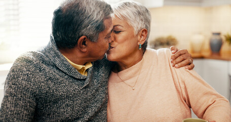 Love, kiss and senior couple in home for strong relationship, connection and bonding together. Retirement, man and woman with romantic embrace for loyalty, marriage commitment and support with care