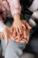 Mom dad and child holding hands together. Family love. Family hands and adult support. A happy family