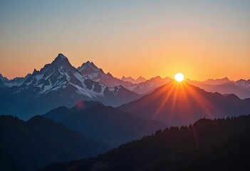dramatic mountain sunrise with snow capped peaks and vibrant orange sky