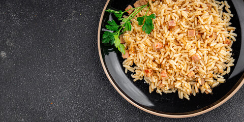 Rice with ham meat main course delicious fresh delicious gourmet food background on the table rustic food top view copy space