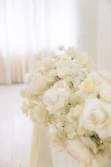 Wedding decoration in a restaurant. White flowers, serving and decor for a wedding