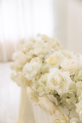 Wedding decoration in a restaurant. White flowers, serving and decor for a wedding