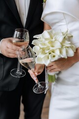 Couple drinking champagne cheering with a glass of wine